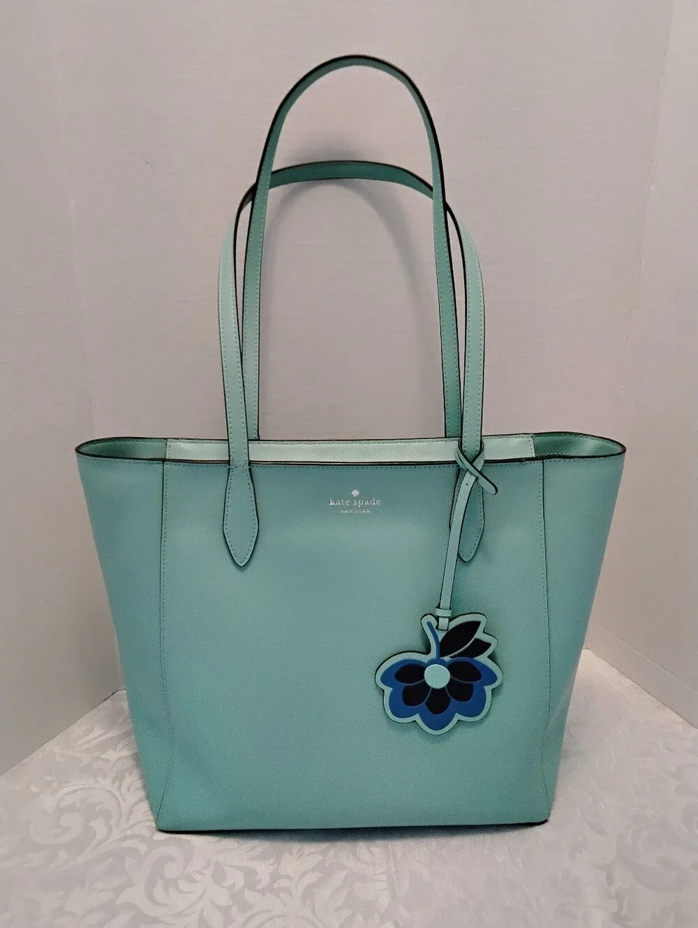 KATE SPADE NY DANA Aqua Bloom Pebbled Leather Tote with Leather Floral Charm